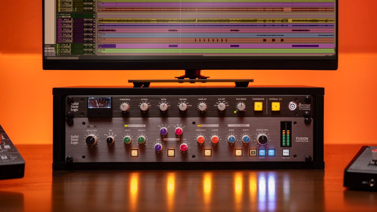 SSL Bus Comp Classic racked above an SSL Fusion in a studio